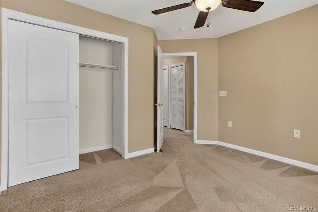 a view of balcony with wooden floor and fence
