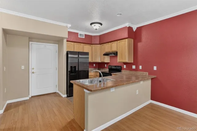 a view of a kitchen with a microwave and cabinets