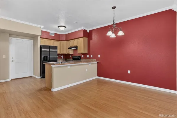 a view of a kitchen cabinets and wooden floor
