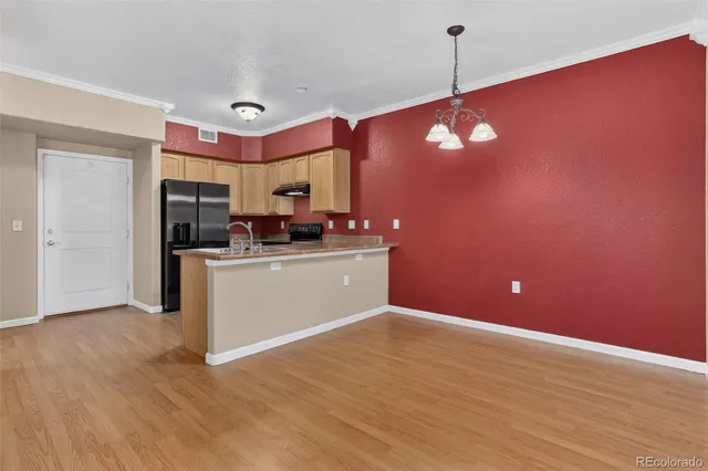 a view of a kitchen cabinets and wooden floor
