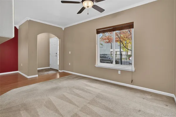 a view of an empty room with a fireplace