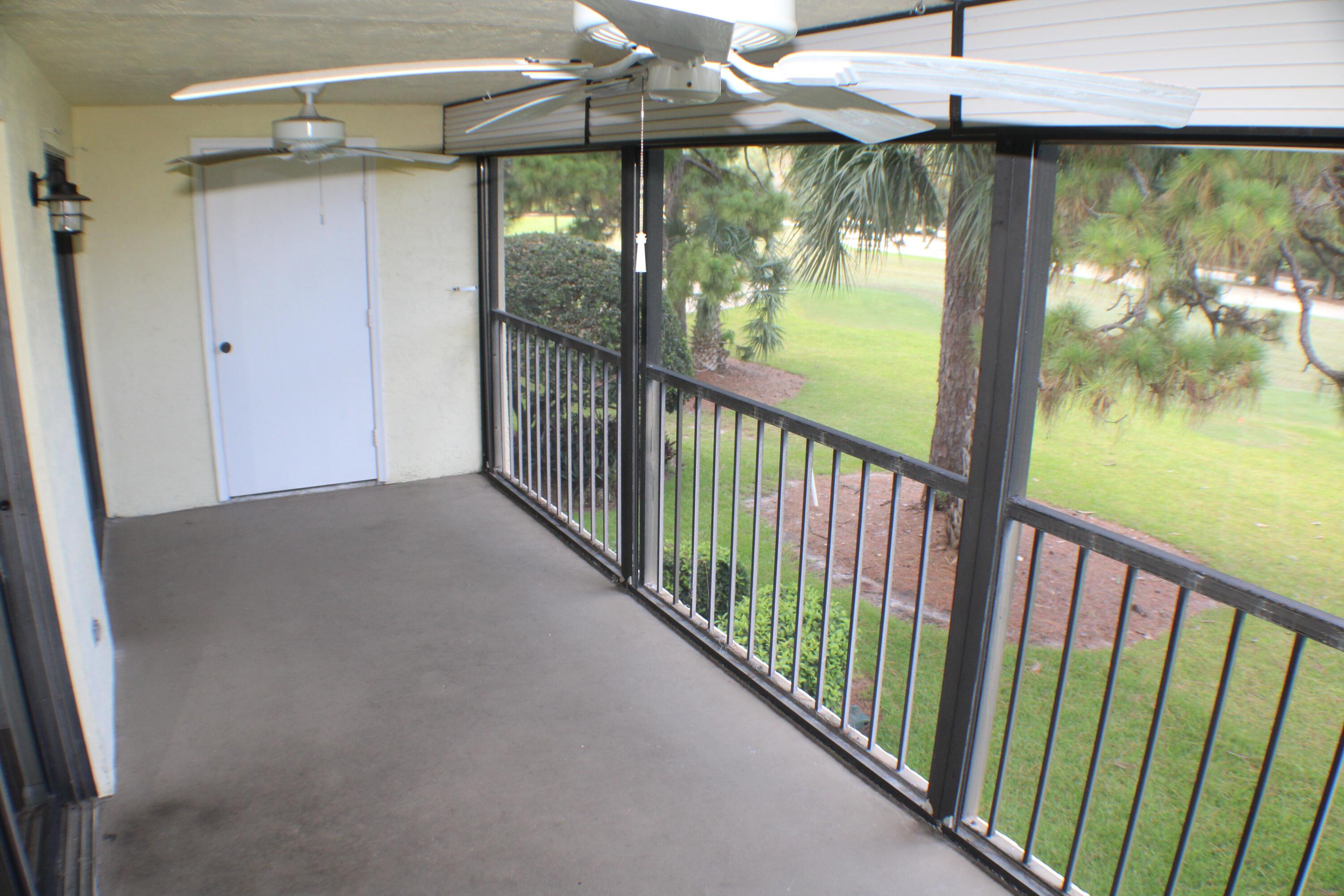 1082 Keystone Drive, Unit C Jupiter, FL 33458 - Photo 17 of 26 Screened balcony porch