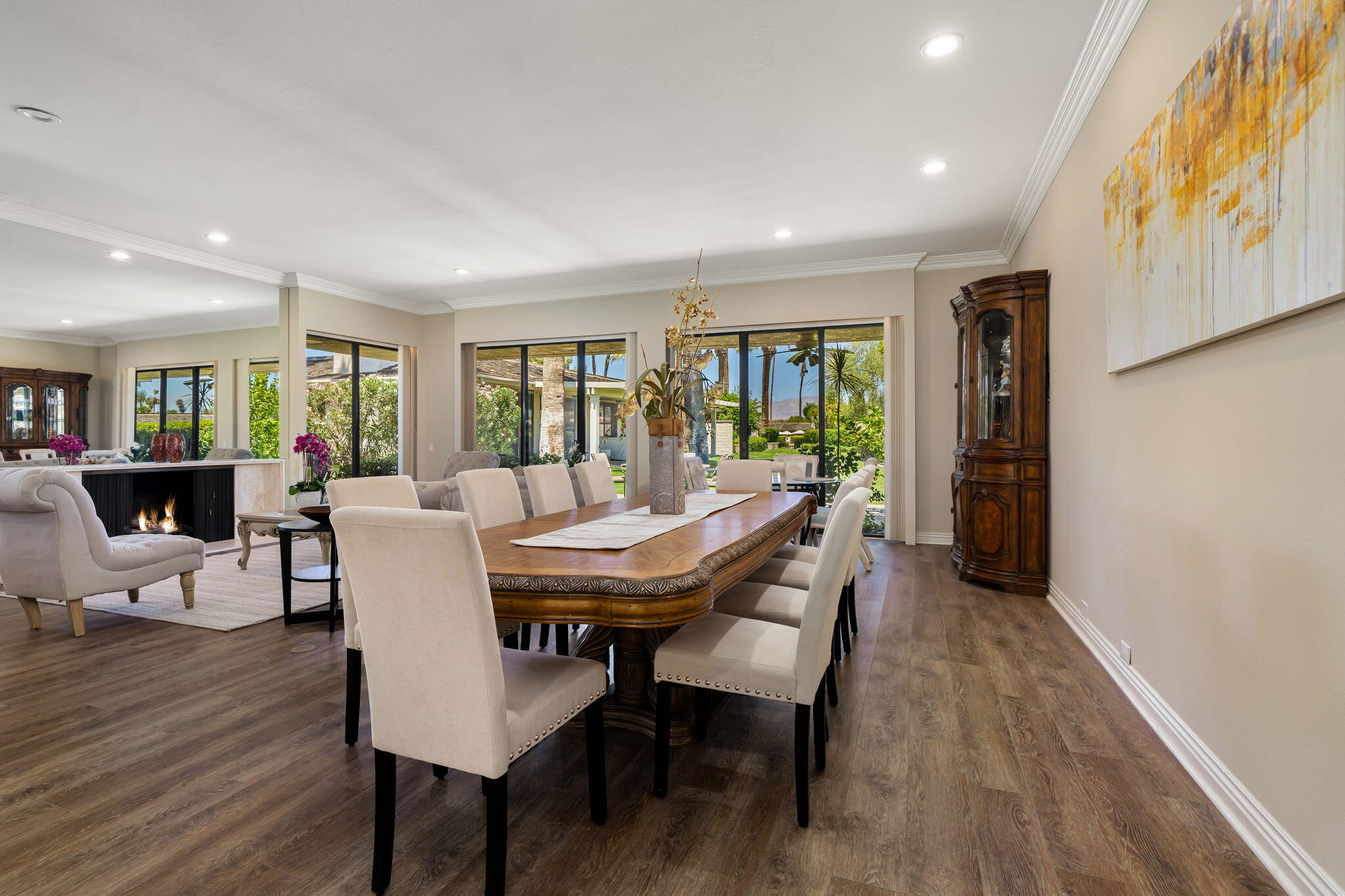 140 Columbia Drive Rancho Mirage, CA 92270 - Photo 15 of 42 a view of a dining room with furniture and wooden floor