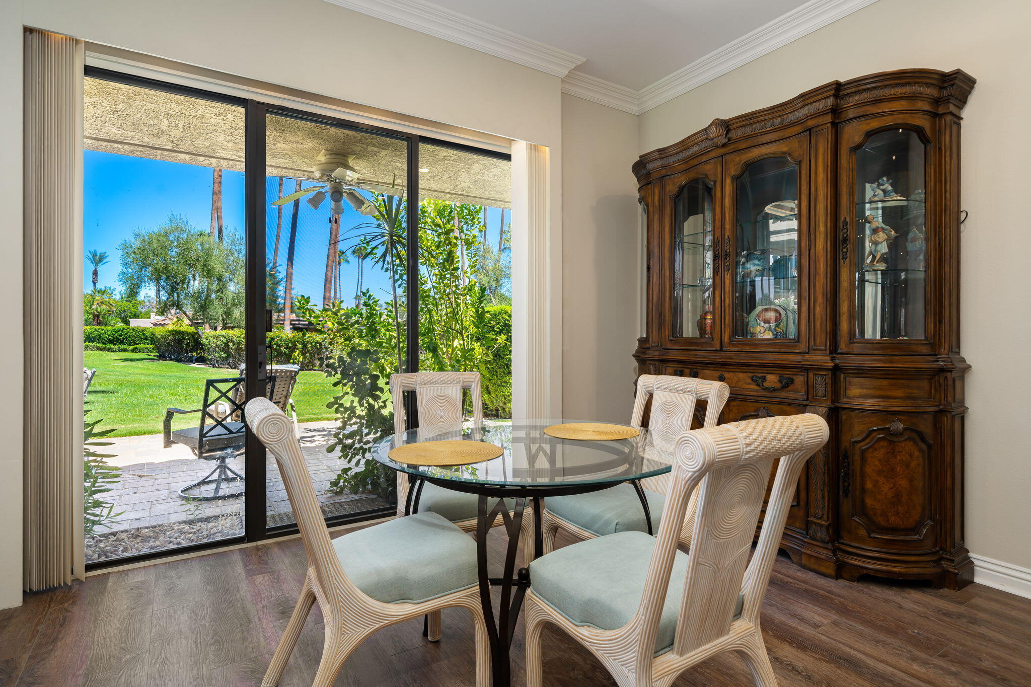 140 Columbia Drive Rancho Mirage, CA 92270 - Photo 16 of 42 a view of a dining room with furniture window and wooden floor