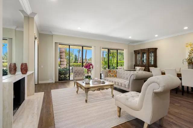 a bedroom with furniture and a flat screen tv