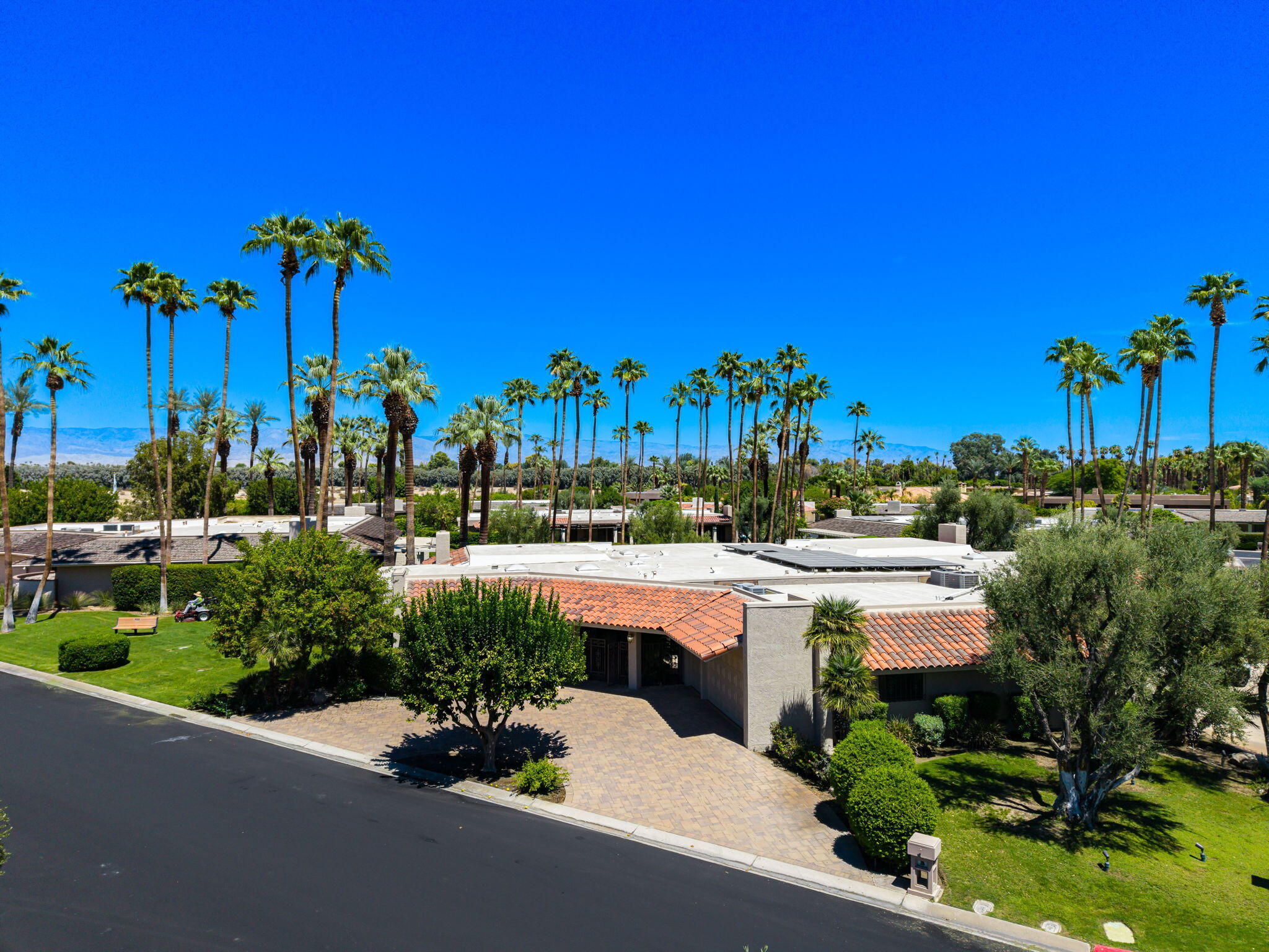 140 Columbia Drive Rancho Mirage, CA 92270 - Photo 2 of 42 a view of a swimming pool and outdoor seating