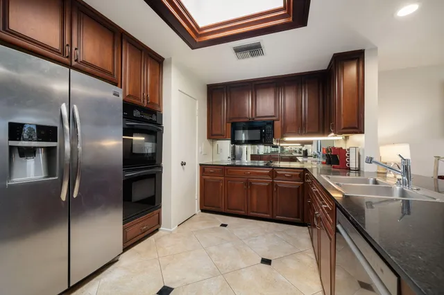 a kitchen with lots of counter top space and appliances