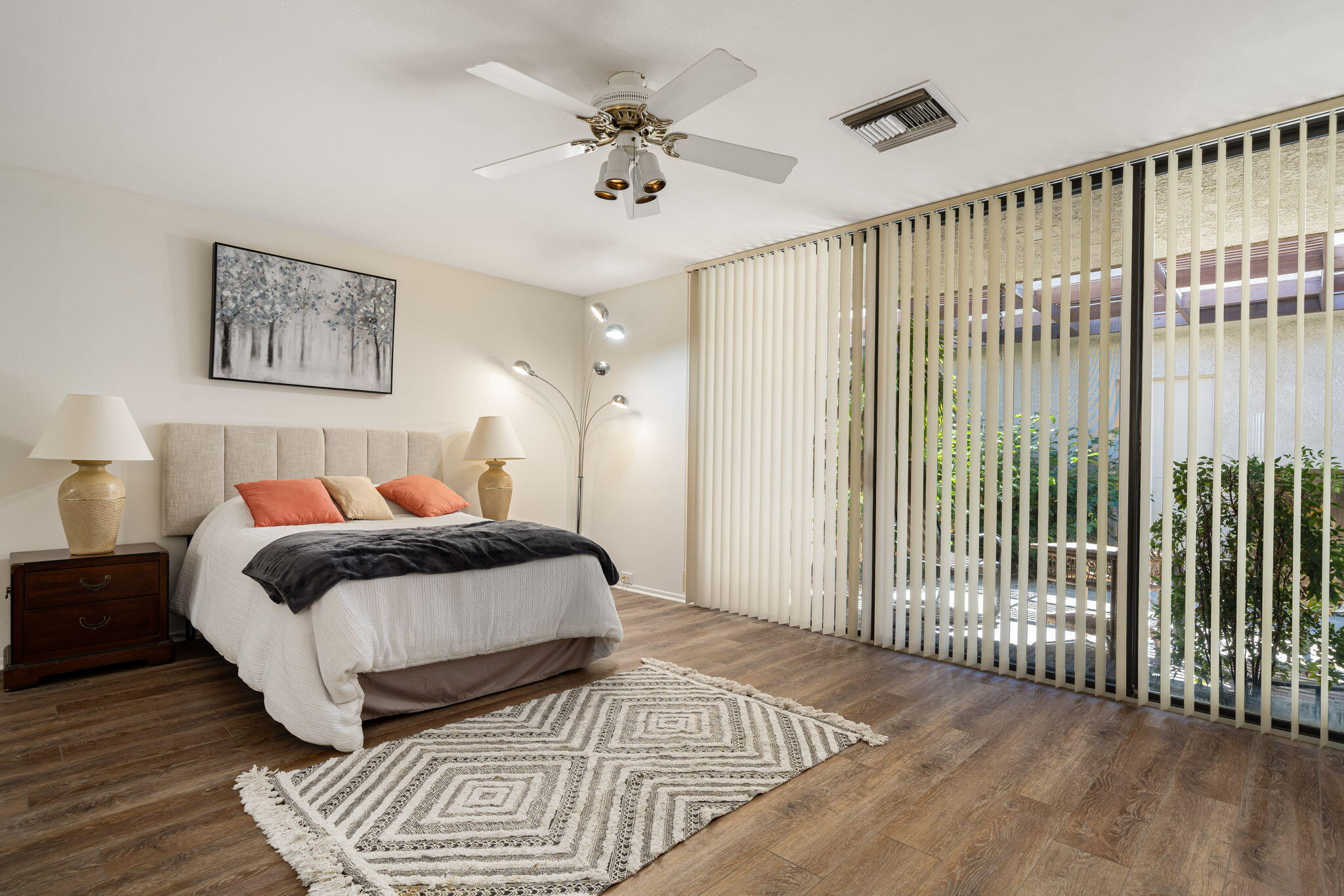 140 Columbia Drive Rancho Mirage, CA 92270 - Photo 38 of 42 a bedroom with a bed and a chandelier