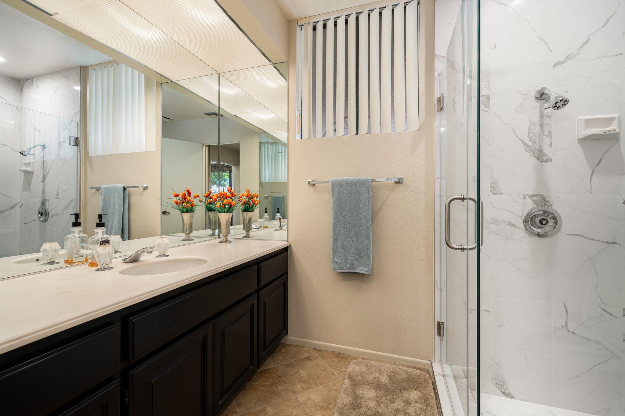 140 Columbia Drive Rancho Mirage, CA 92270 - Photo 41 of 42 a bathroom with a double vanity sink a mirror and shower