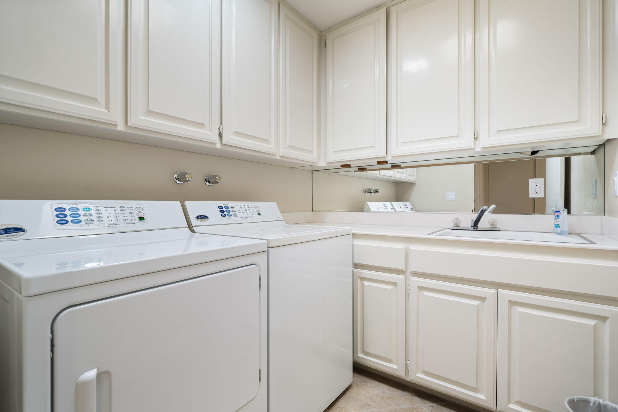 140 Columbia Drive Rancho Mirage, CA 92270 - Photo 42 of 42 a utility room with dryer and washer