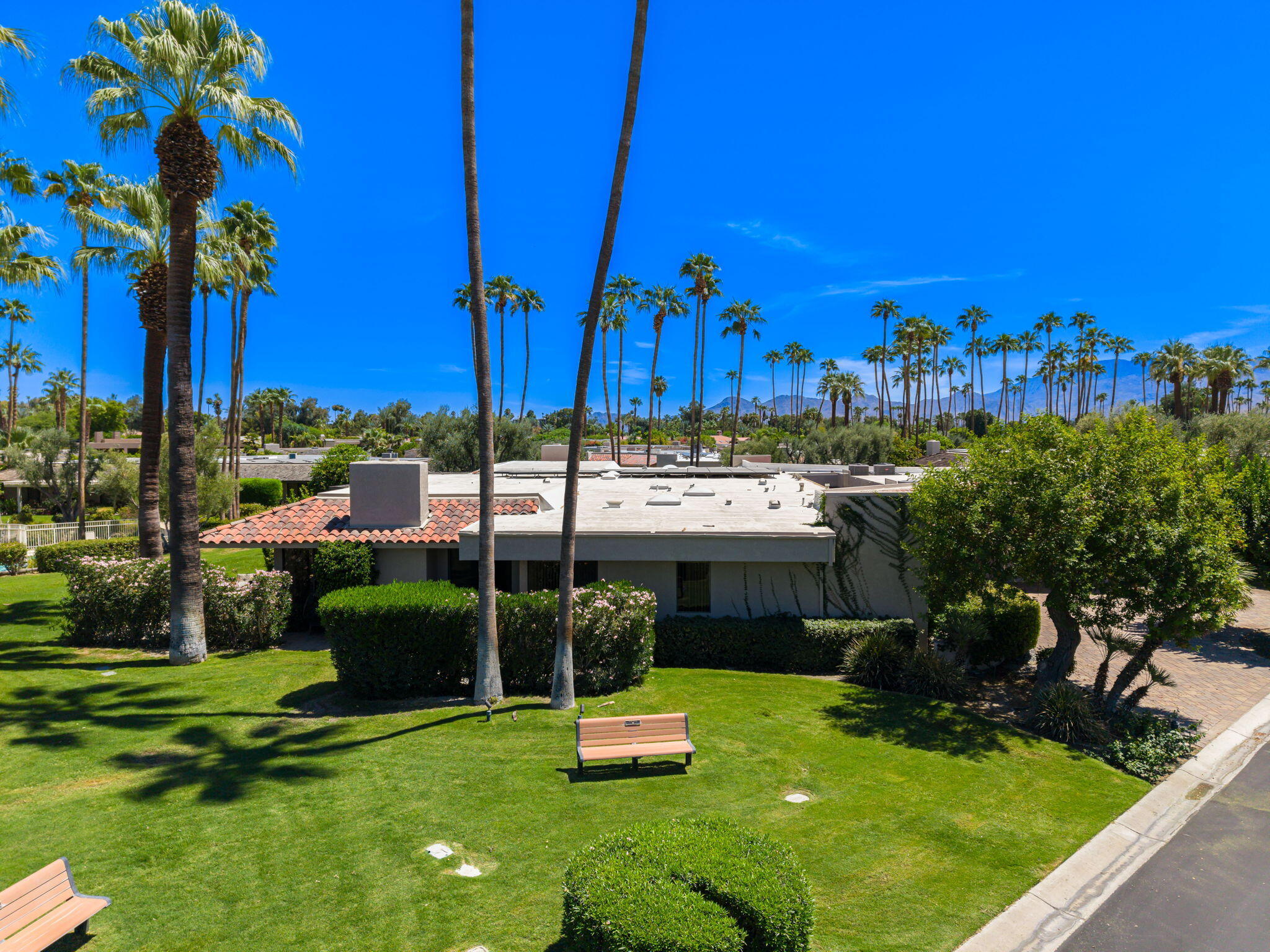 140 Columbia Drive Rancho Mirage, CA 92270 - Photo 5 of 42 a swimming pool with outdoor seating and yard