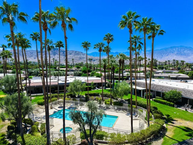 a view of a porch with furniture and a potted plant