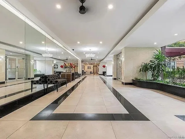 a view of a lobby with black carpet