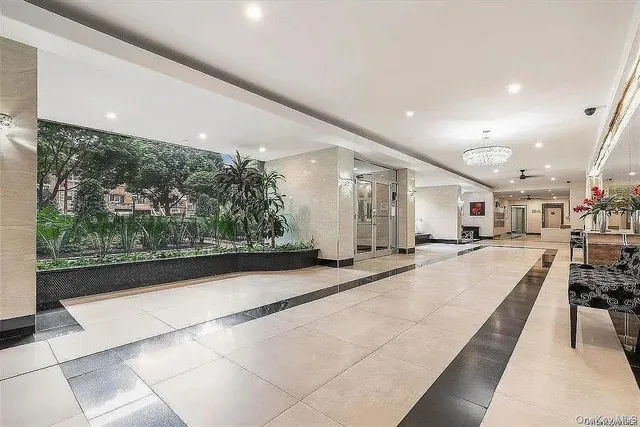 a view of a lobby with black carpet