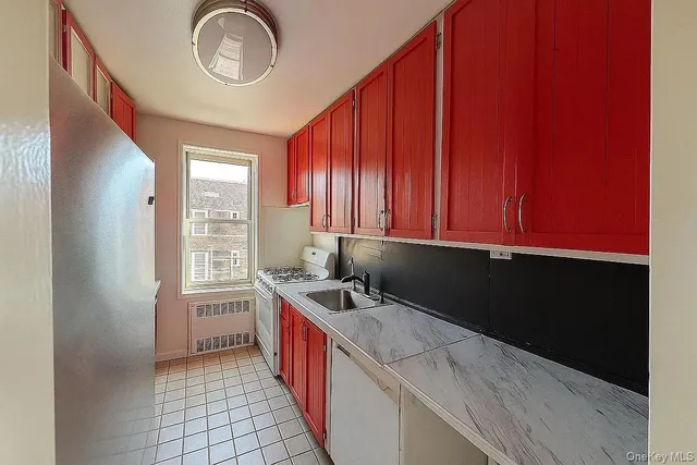 a kitchen with a sink and a window