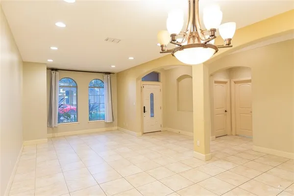 a view of an entryway with a chandelier