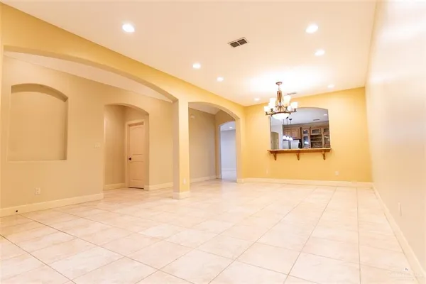 a view of a hallway with a kitchen