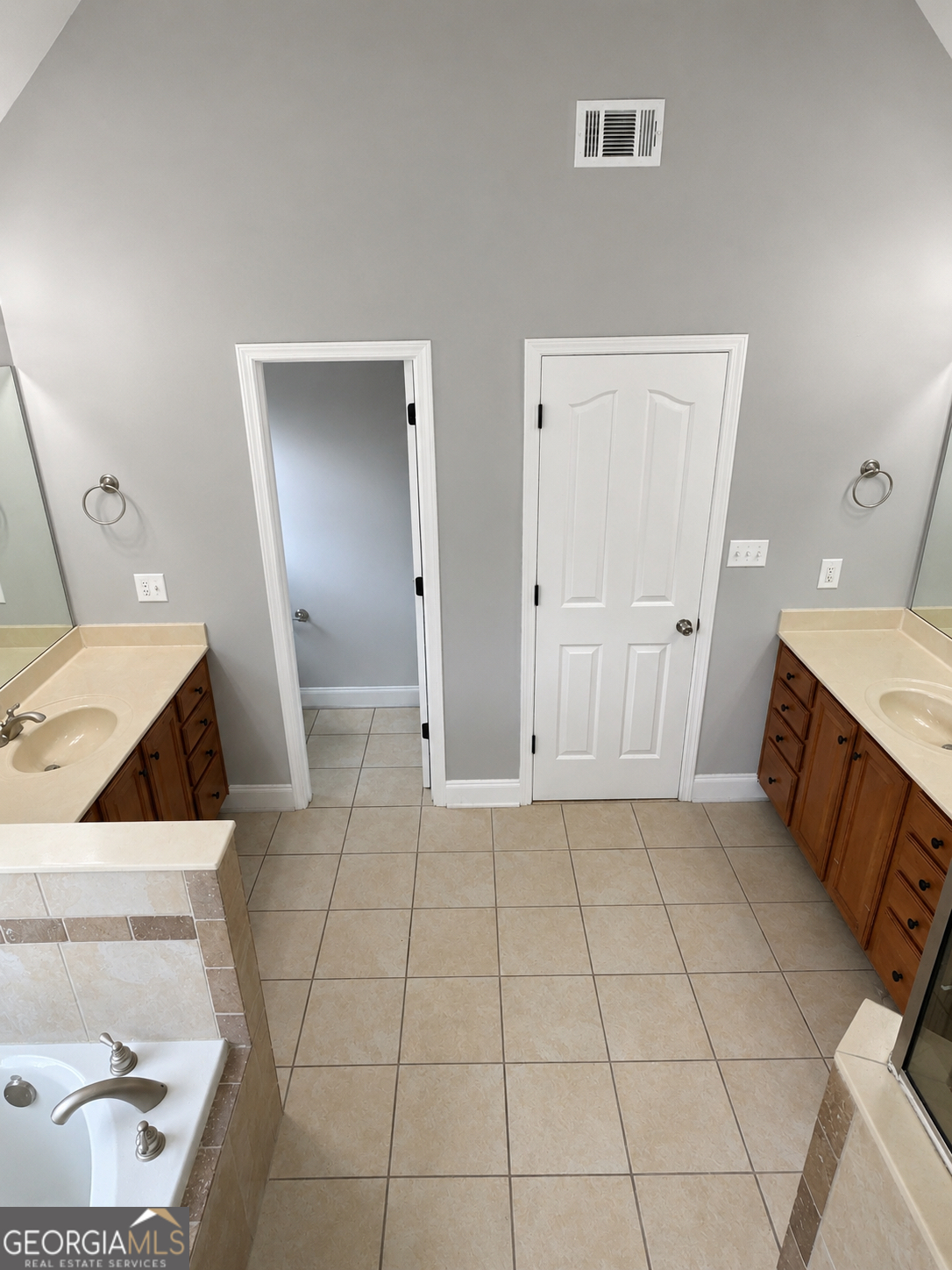 2614 Dolostone Way Dacula, GA 30019 - Photo 19 of 29 a bathroom with a sink and a mirror