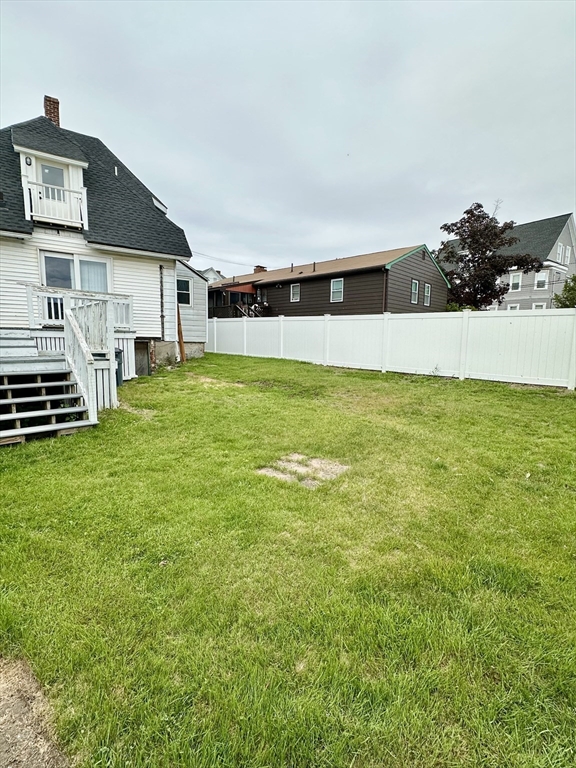 304 Main Street, Unit 2 Winthrop, MA 02152 - Photo 9 of 9 a front view of a house with a yard