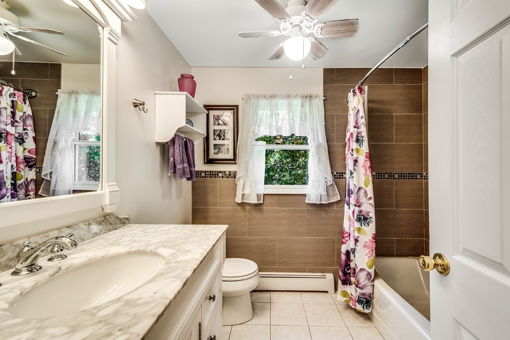 178 Reed Farm Road Boxborough, MA 01719 - Photo 21 of 30 a bathroom with a granite countertop sink toilet a shower and a mirror