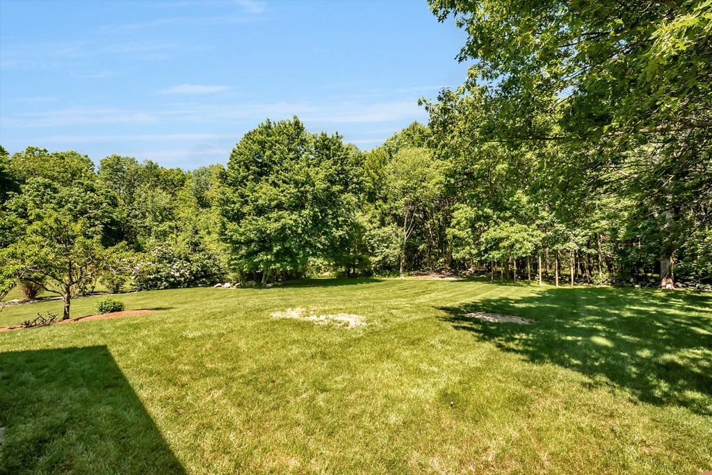 178 Reed Farm Road Boxborough, MA 01719 - Photo 27 of 30 a view of a big yard with large trees