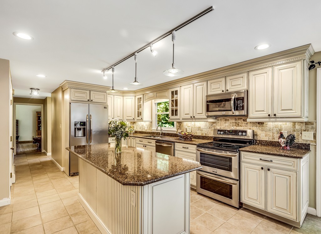 178 Reed Farm Road Boxborough, MA 01719 - Photo 4 of 30 a kitchen with stainless steel appliances granite countertop a stove and a sink