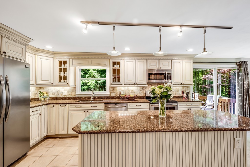 178 Reed Farm Road Boxborough, MA 01719 - Photo 5 of 30 a kitchen with stainless steel appliances granite countertop a sink and a refrigerator