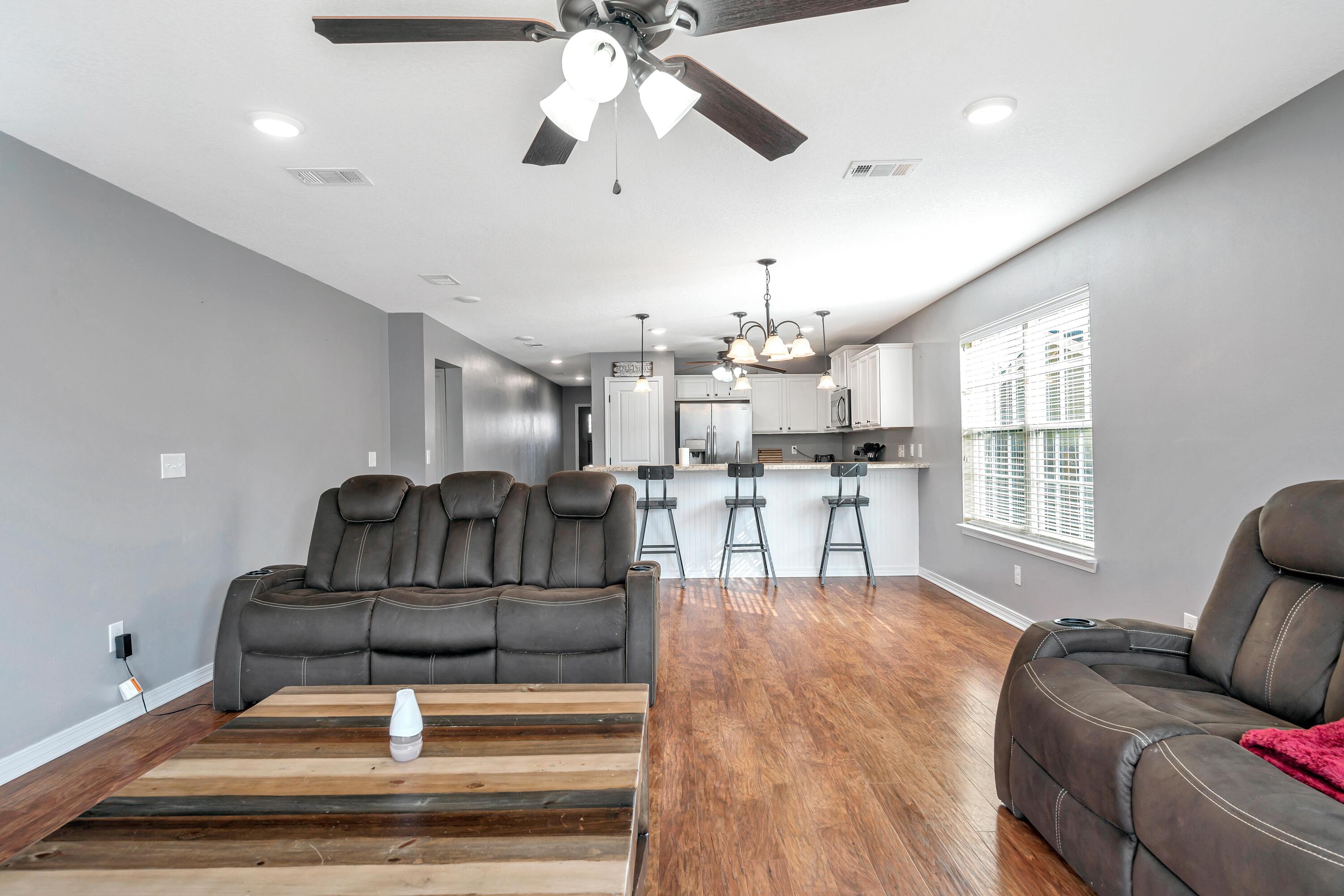 505 Eisenhower Drive Crestview, FL 32539 - Photo 11 of 39 a living room with furniture and kitchen view
