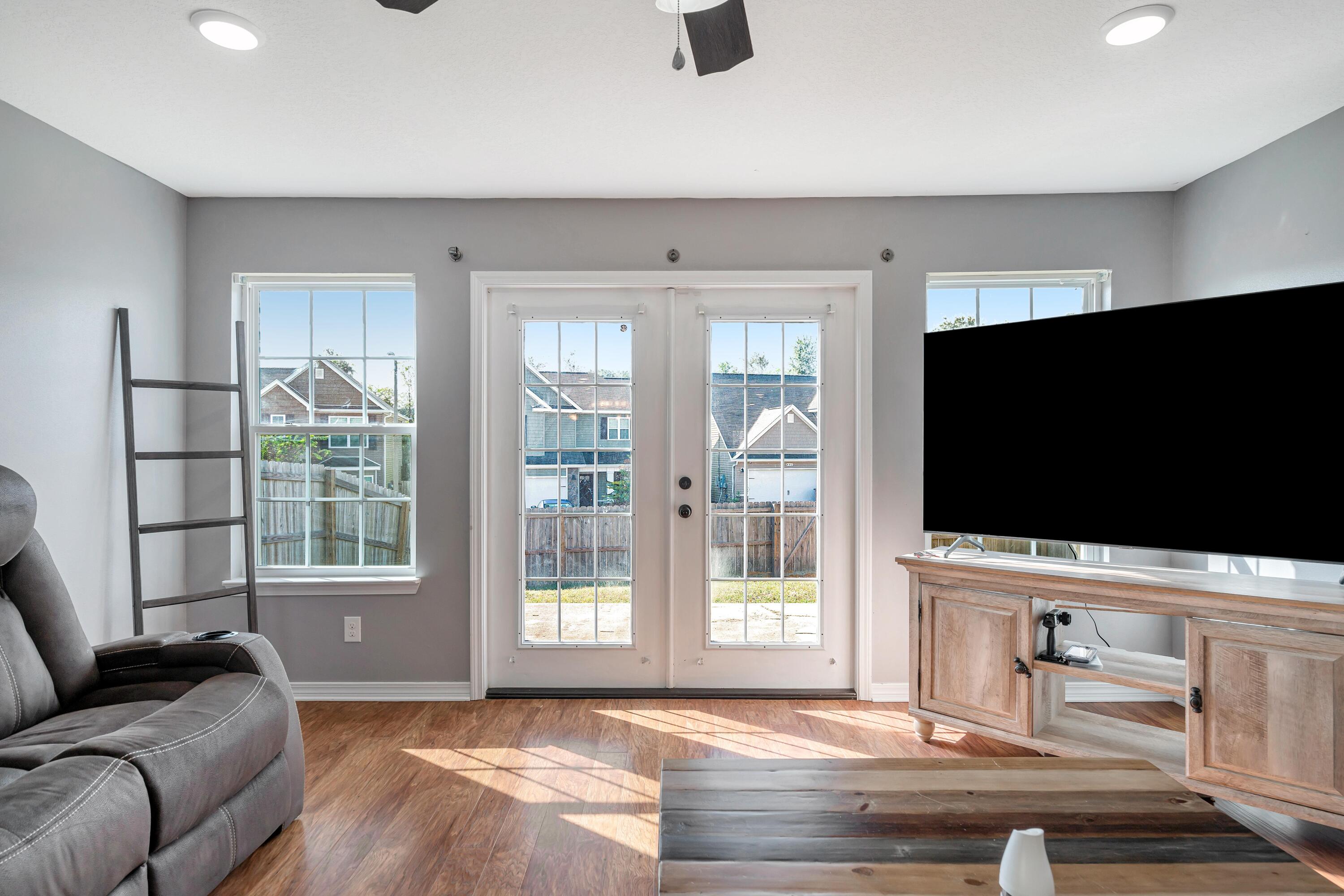505 Eisenhower Drive Crestview, FL 32539 - Photo 12 of 39 a living room with furniture and a flat screen tv