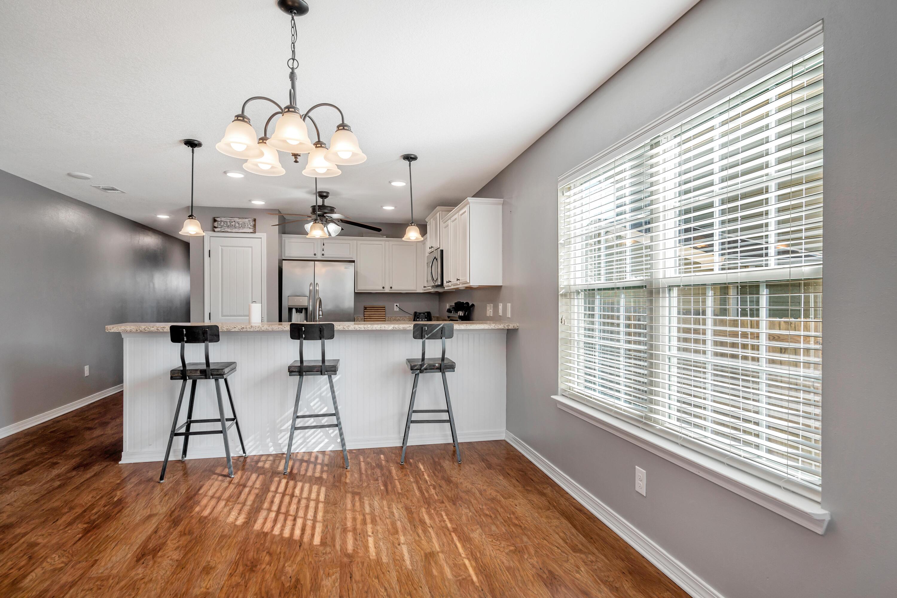 505 Eisenhower Drive Crestview, FL 32539 - Photo 15 of 39 a view of a kitchen with furniture and windows