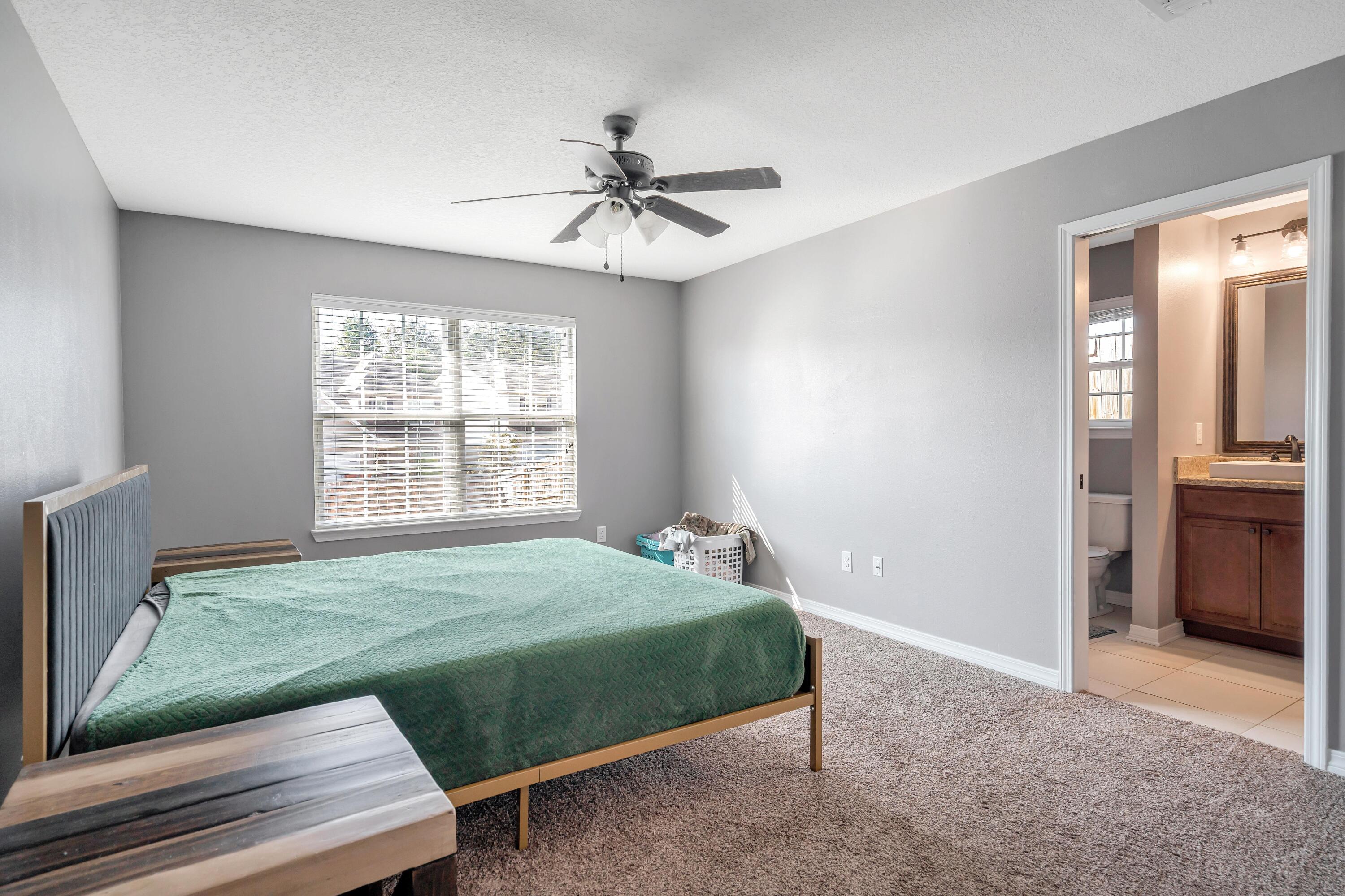 505 Eisenhower Drive Crestview, FL 32539 - Photo 16 of 39 a bedroom with a bed and a window