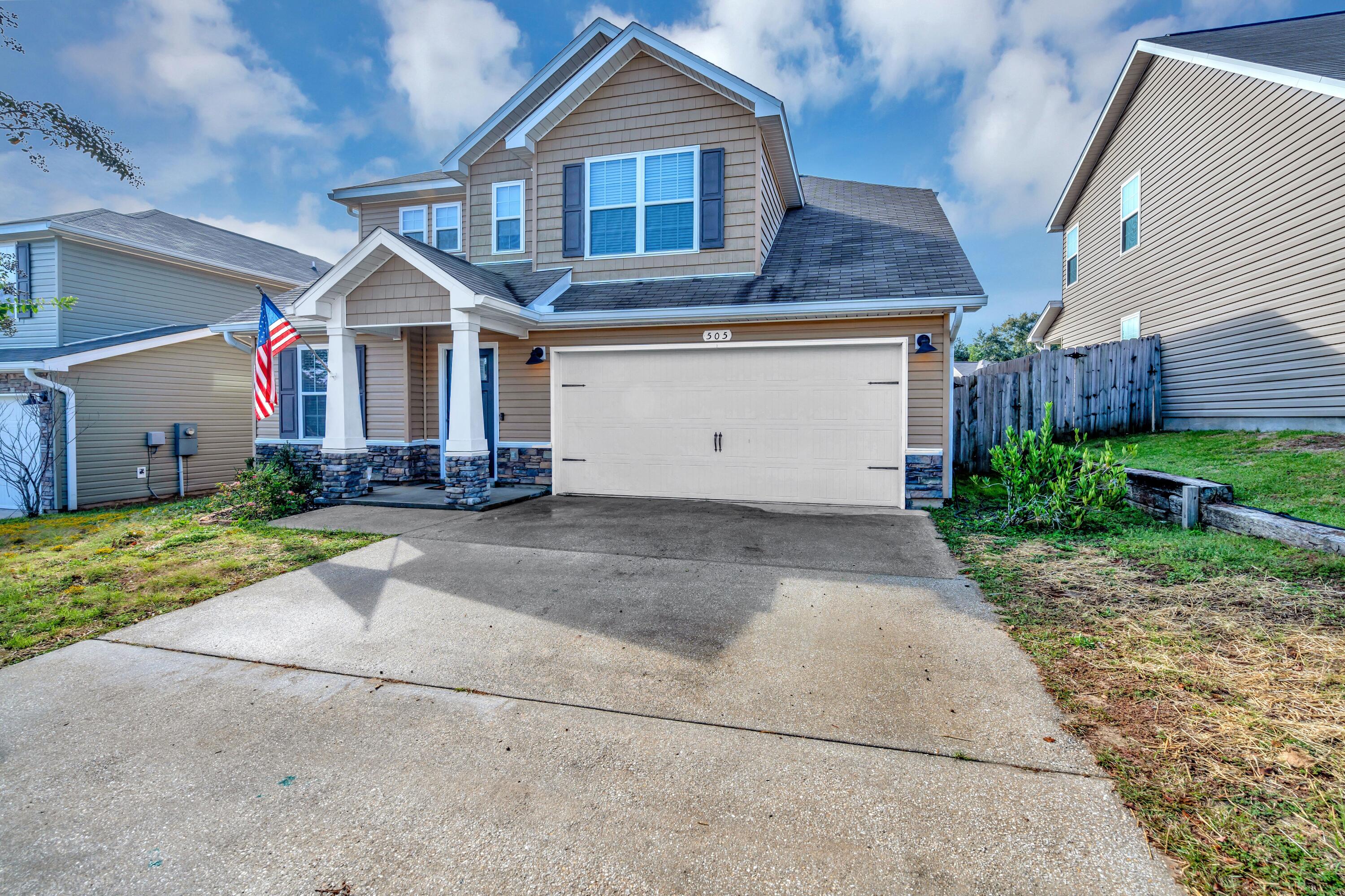 505 Eisenhower Drive Crestview, FL 32539 - Photo 2 of 39 a front view of a house with a yard