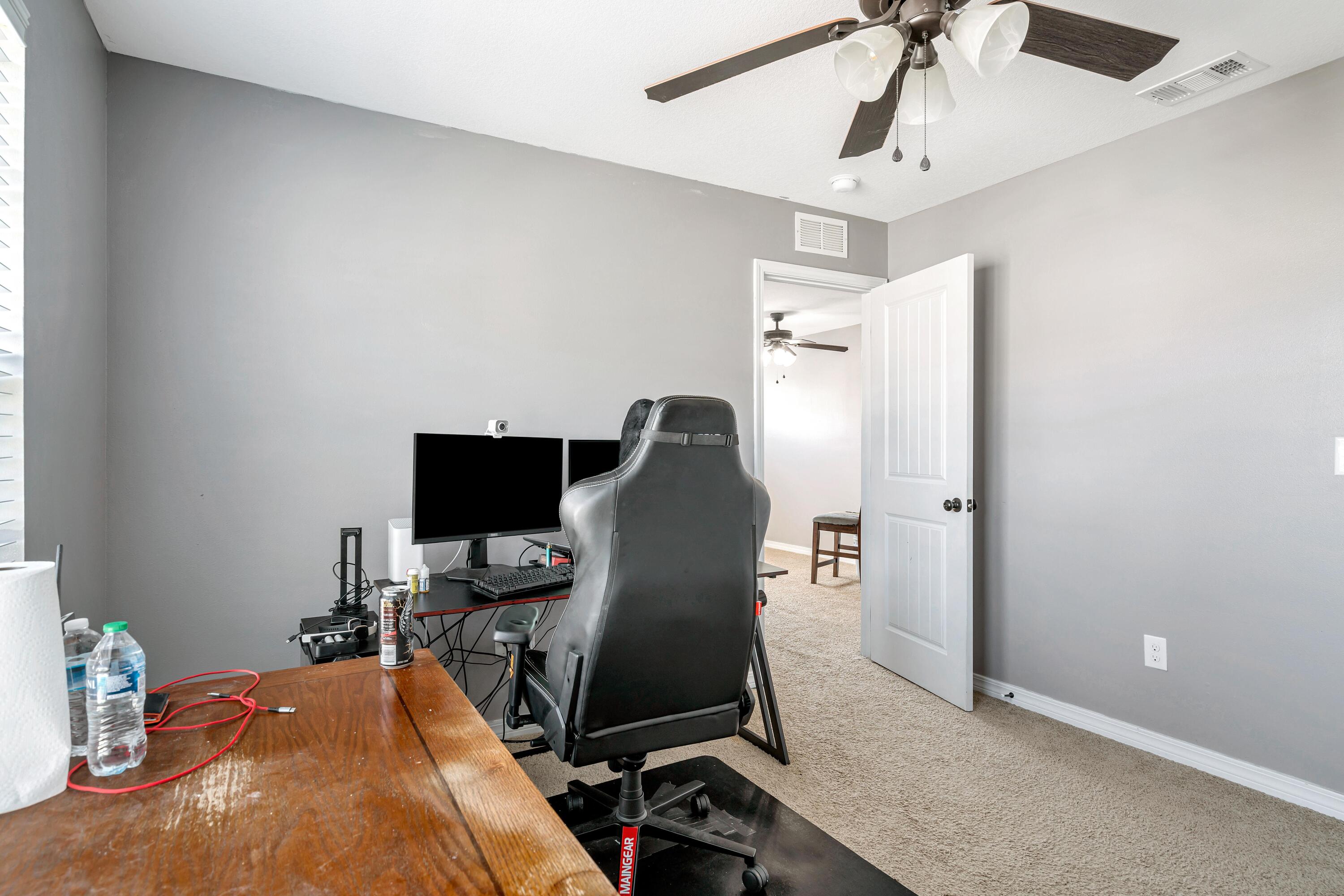505 Eisenhower Drive Crestview, FL 32539 - Photo 27 of 39 a view of a workspace with furniture and gym equipment