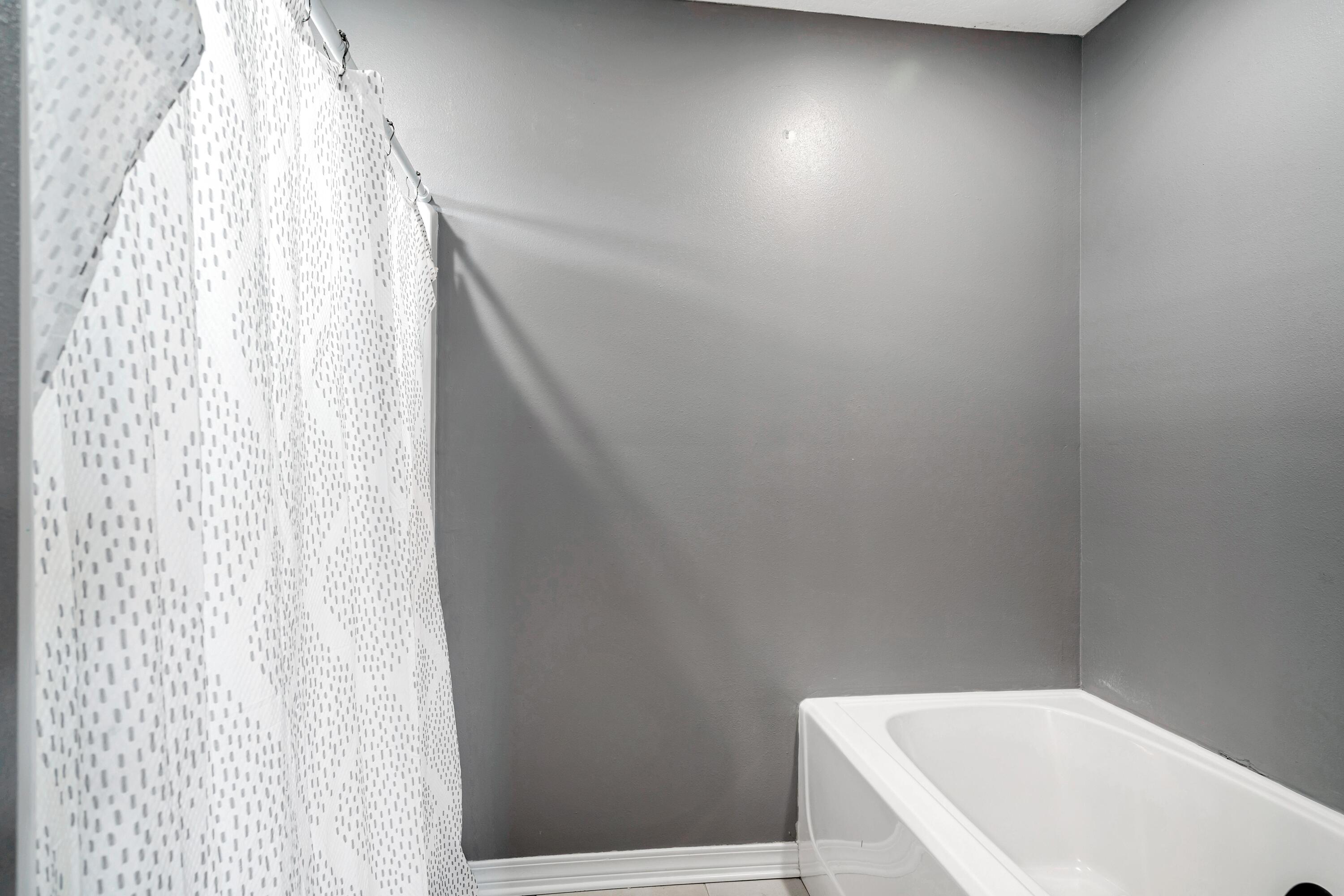 505 Eisenhower Drive Crestview, FL 32539 - Photo 30 of 39 a bathroom with a bathtub and shower