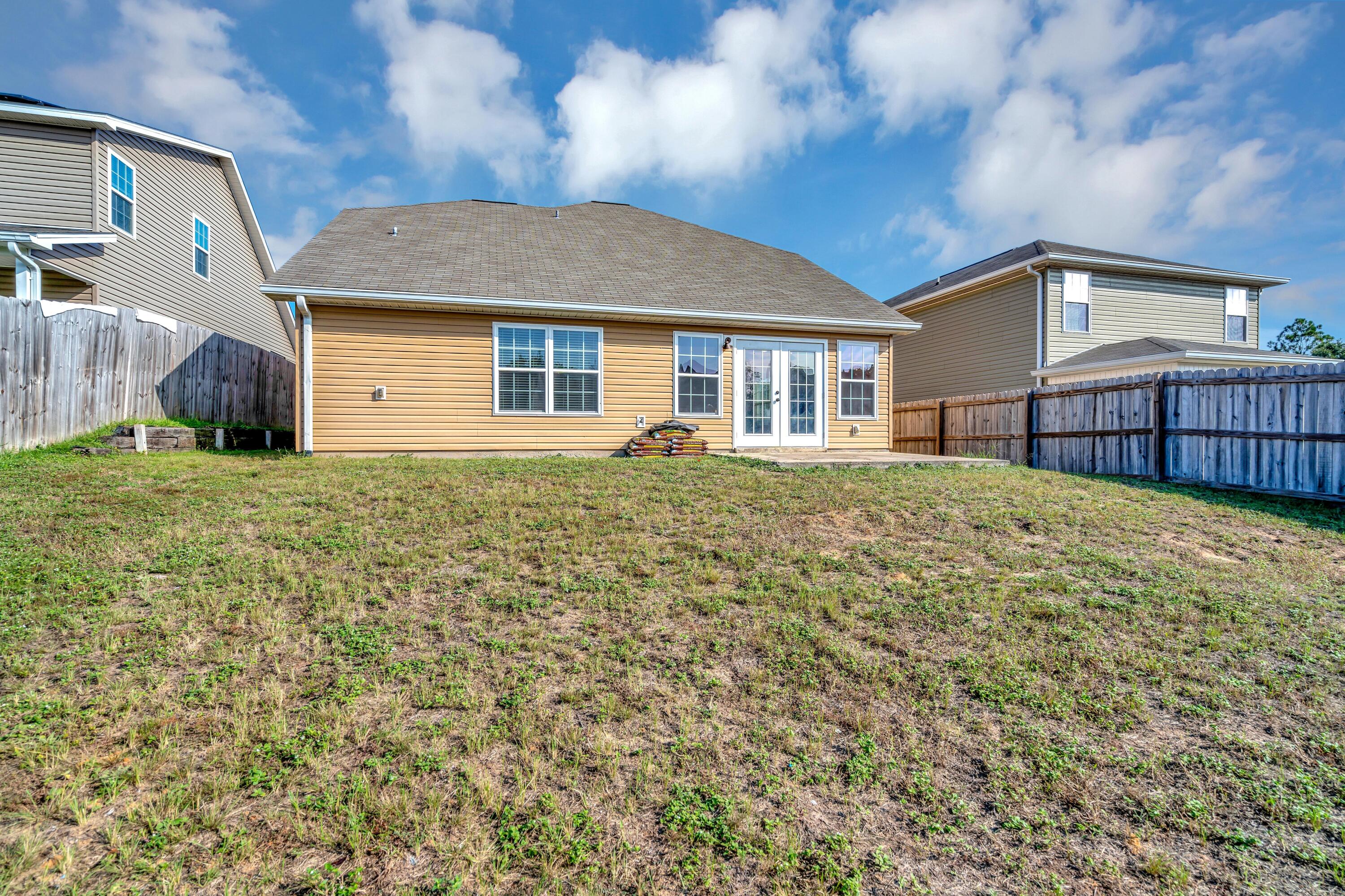 505 Eisenhower Drive Crestview, FL 32539 - Photo 37 of 39 a front view of a house with a yard