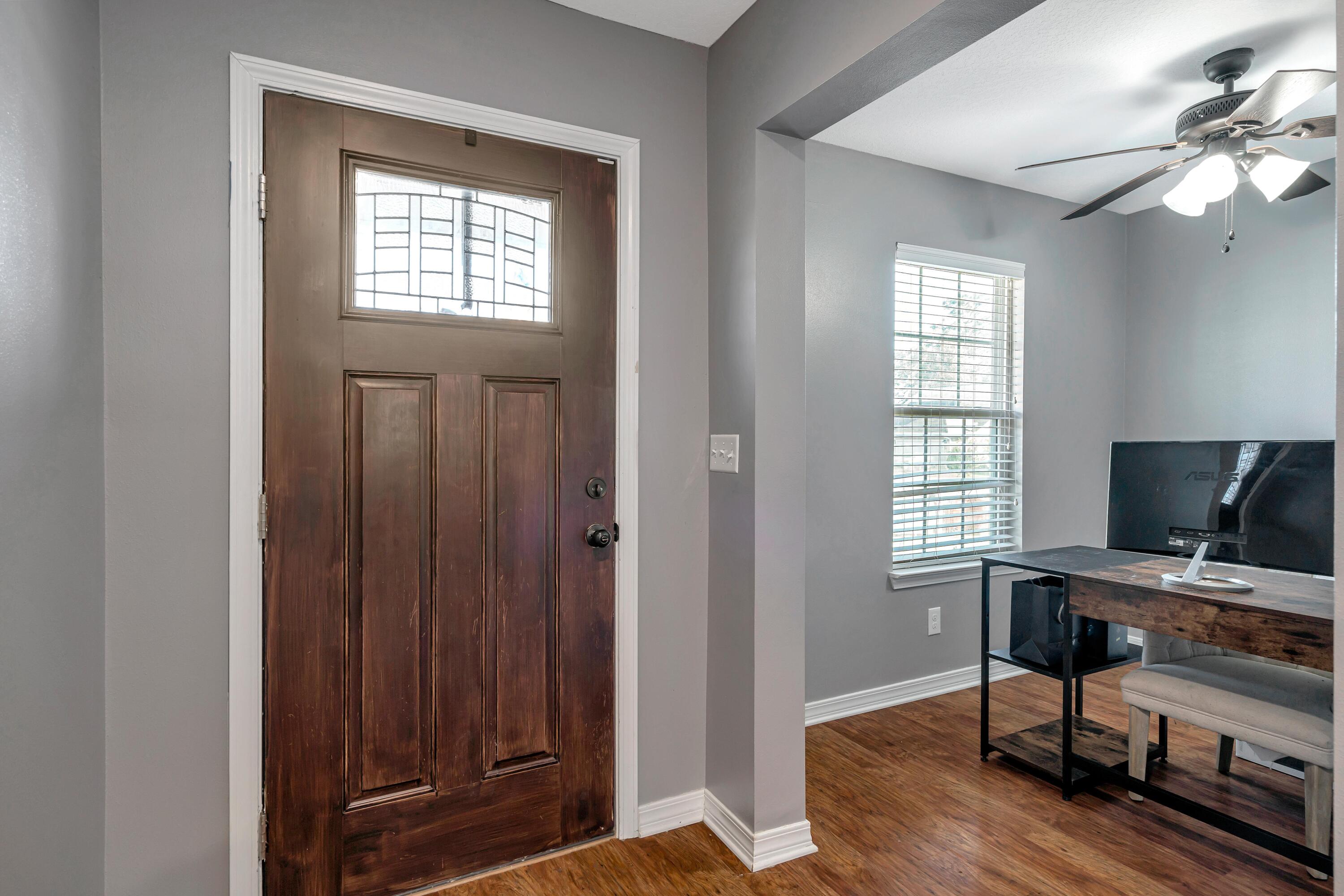 505 Eisenhower Drive Crestview, FL 32539 - Photo 4 of 39 a view of a workspace with furniture and a window