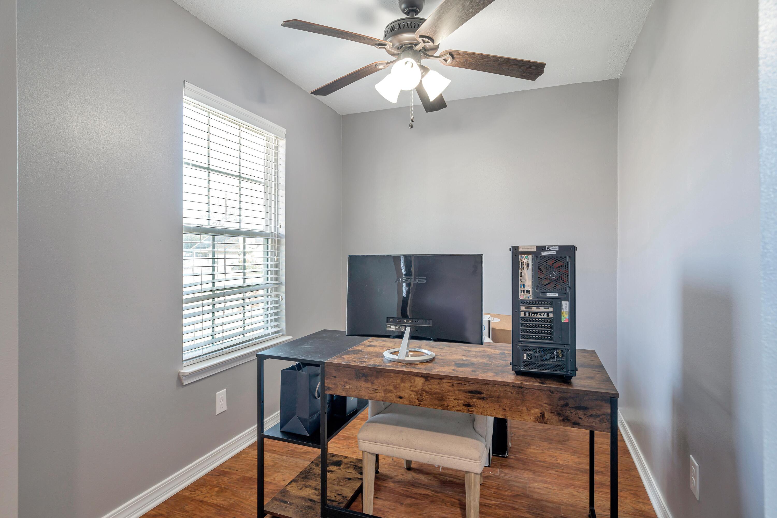 505 Eisenhower Drive Crestview, FL 32539 - Photo 5 of 39 a workspace with furniture and a window