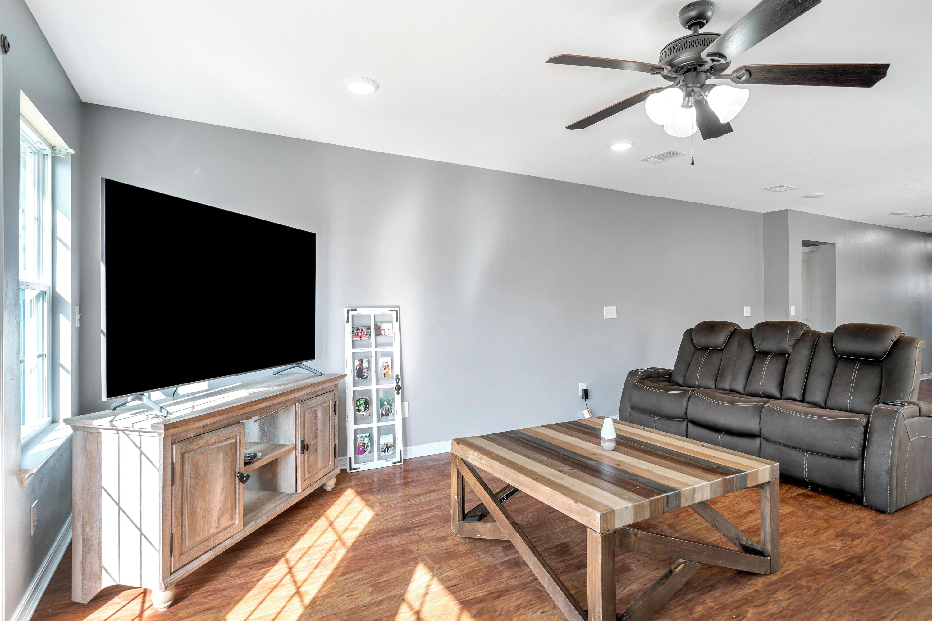 505 Eisenhower Drive Crestview, FL 32539 - Photo 10 of 39 a living room with furniture and a flat screen tv