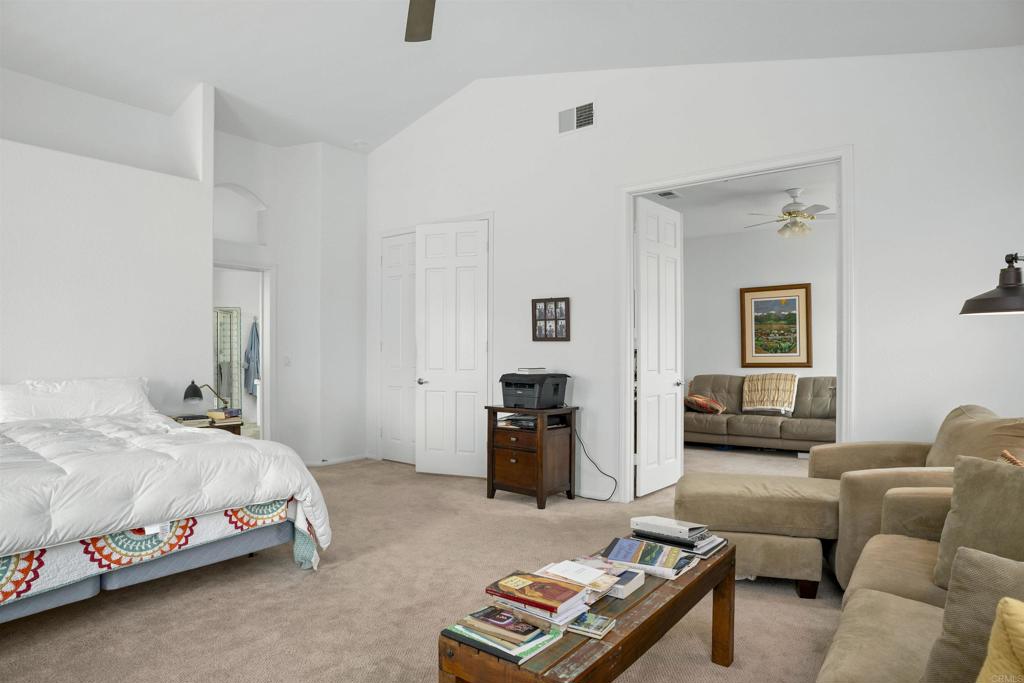 4992 Lassen Drive Oceanside, CA 92056 - Photo 15 of 27 a bedroom with furniture and a couch