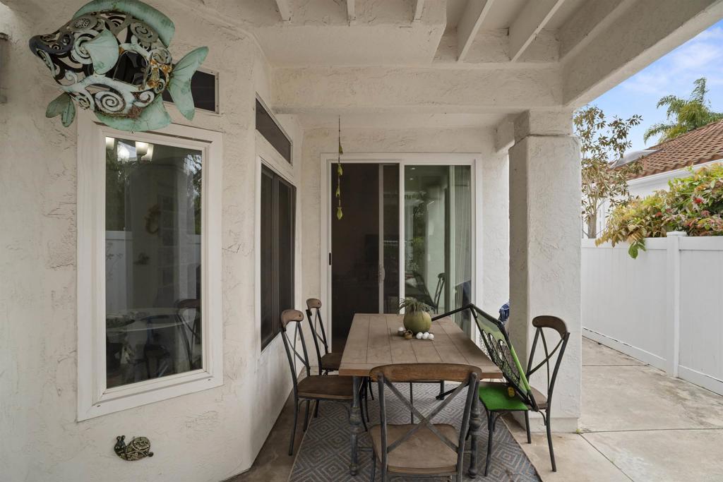 4992 Lassen Drive Oceanside, CA 92056 - Photo 21 of 27 a view of a dining room with furniture and chandelier