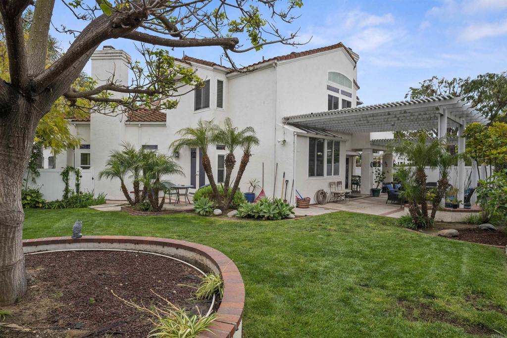 4992 Lassen Drive Oceanside, CA 92056 - Photo 23 of 27 a front view of a house with garden