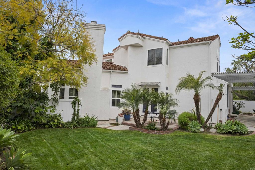 4992 Lassen Drive Oceanside, CA 92056 - Photo 26 of 27 a front view of a house with a yard and potted plants