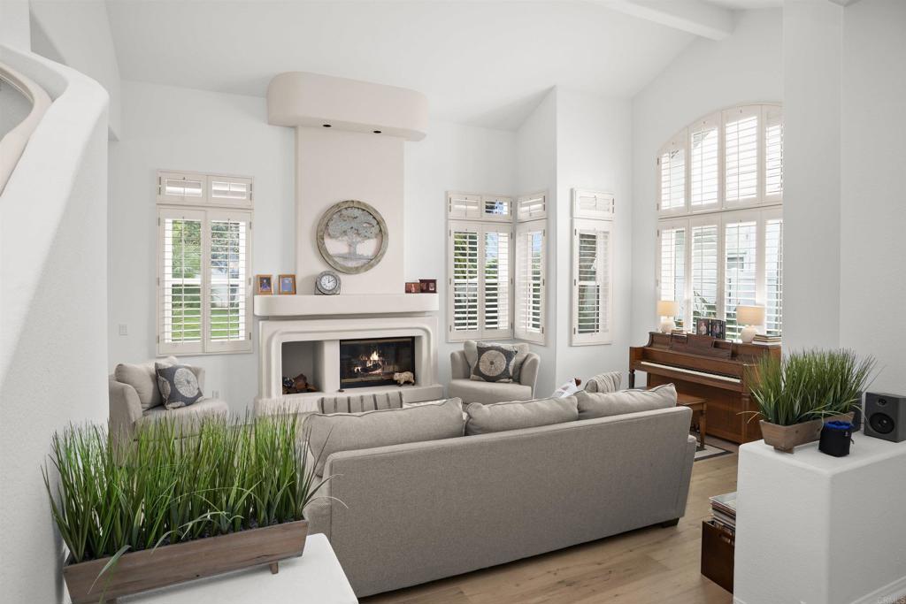 4992 Lassen Drive Oceanside, CA 92056 - Photo 3 of 27 a living room with furniture and a fireplace