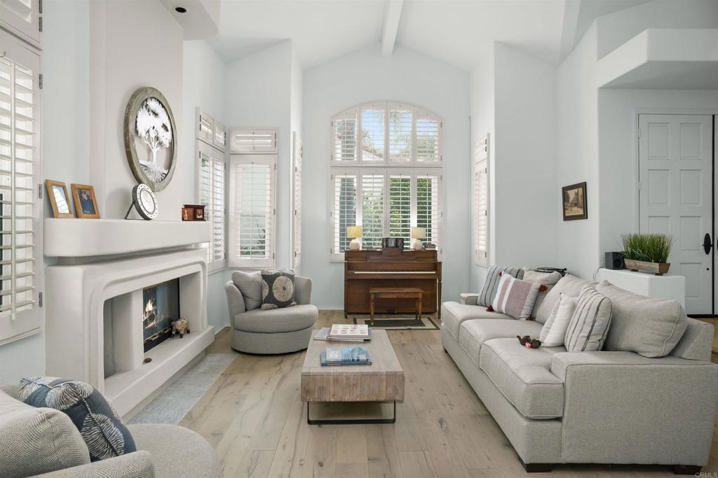 4992 Lassen Drive Oceanside, CA 92056 - Photo 4 of 27 a living room with furniture and a fireplace