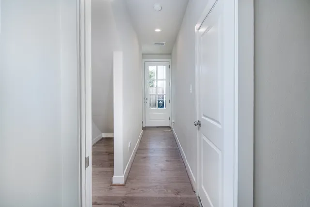 a bathroom with a sink a toilet a mirror and shower curtain