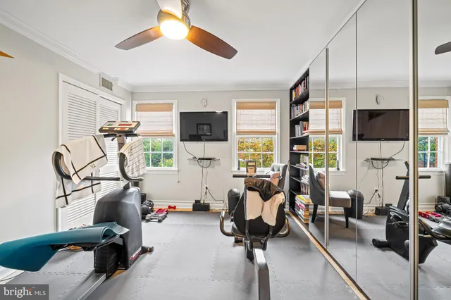 a room with gym equipment and a window