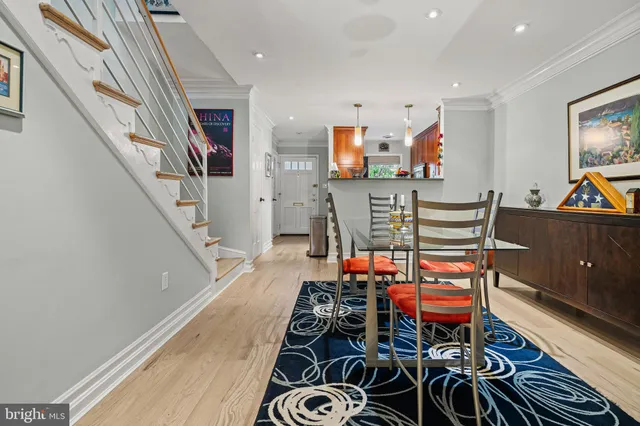 a room with furniture a rug and a chandelier