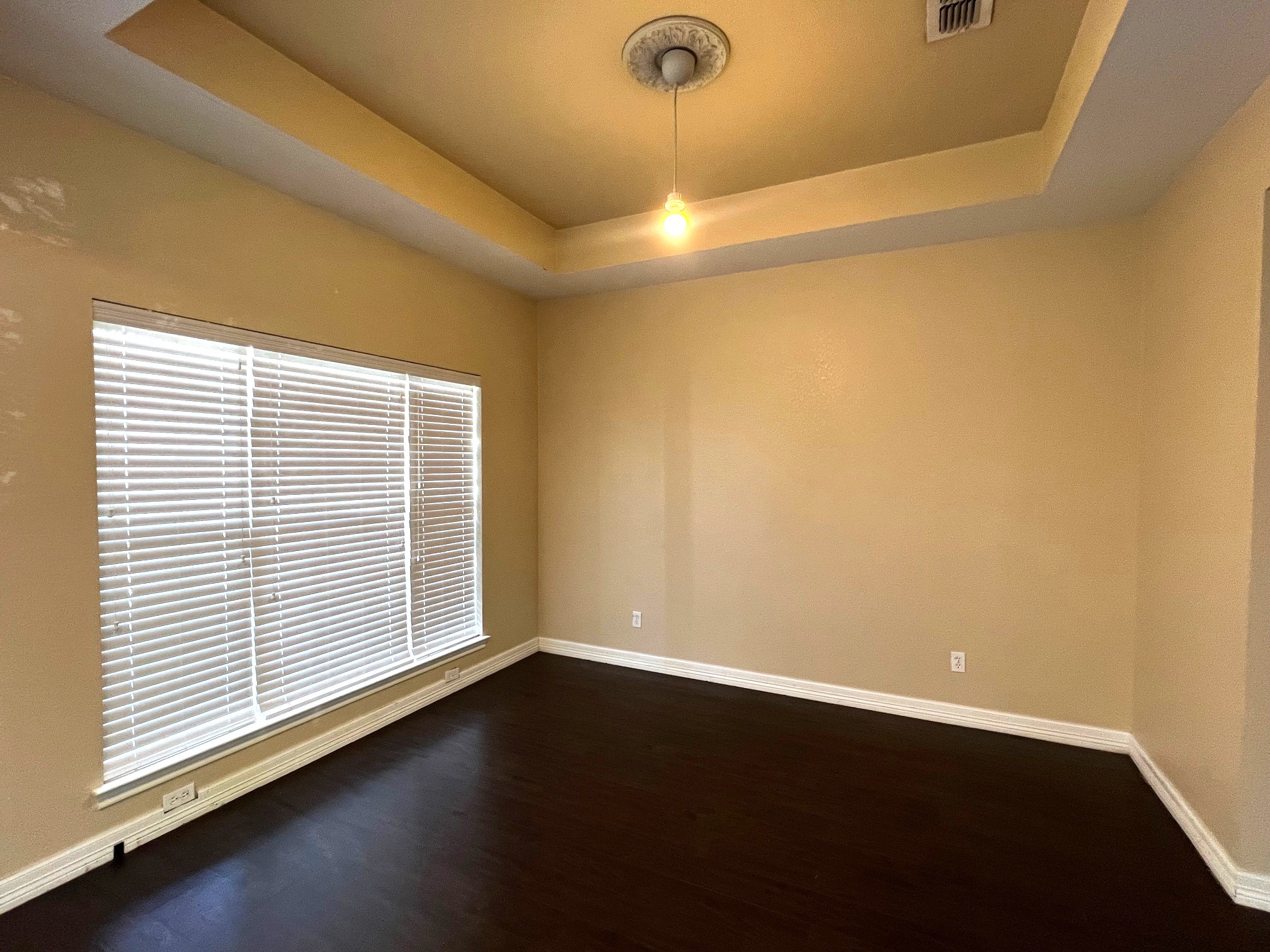 170 Rose Mayer Loop La Grange, TX 78945 - Photo 4 of 19 an empty room with wooden floor and windows