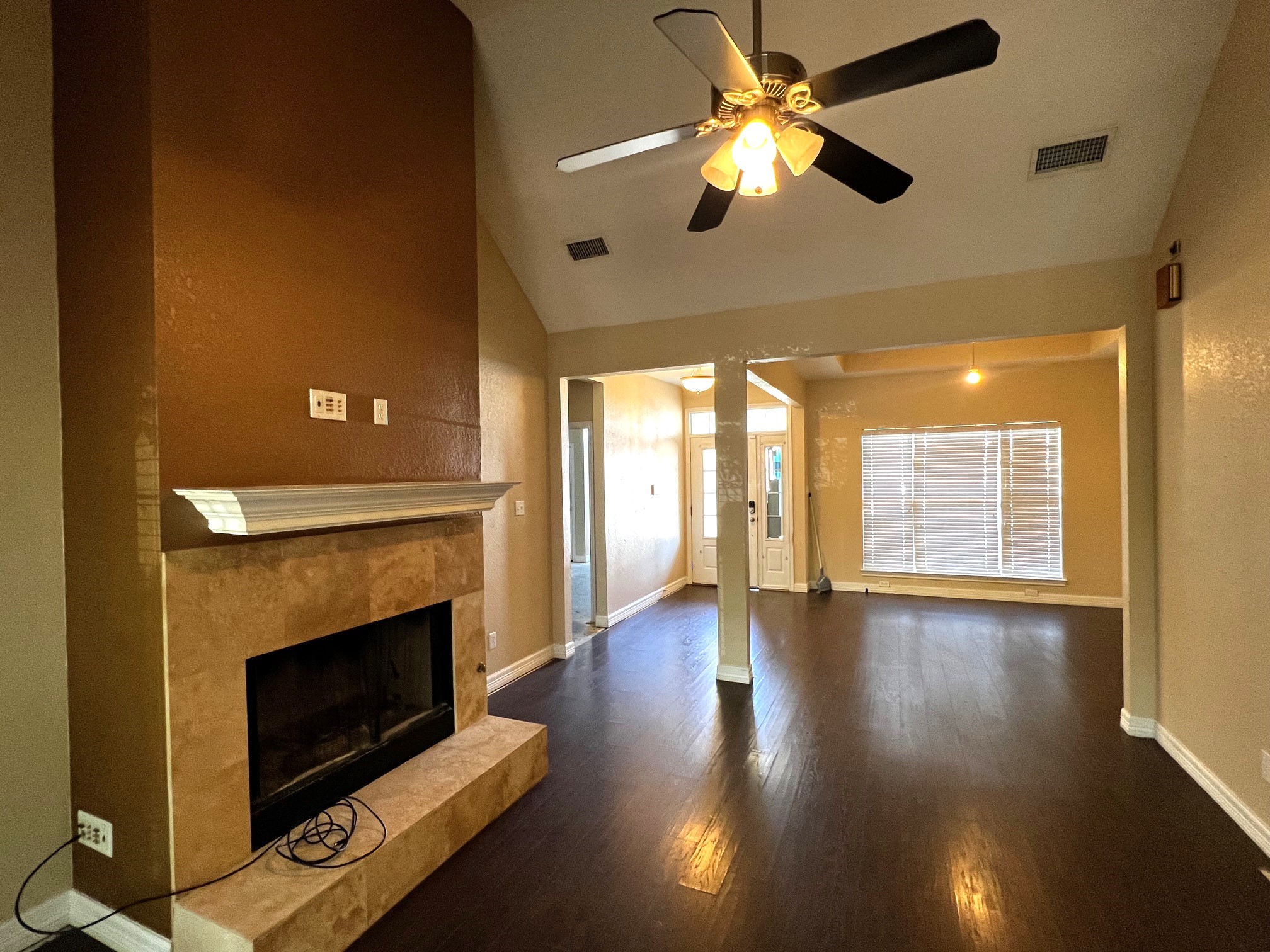 170 Rose Mayer Loop La Grange, TX 78945 - Photo 8 of 19 a view of an empty room with wooden floor and a fireplace