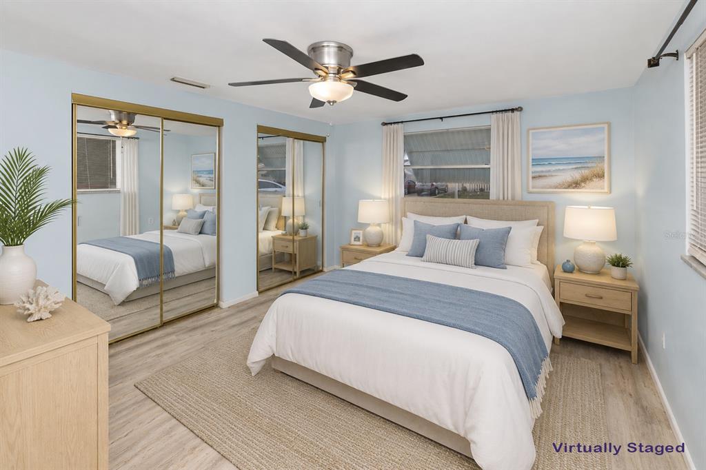 3128 Kilburn Road Holiday, FL 34691 - Photo 2 of 28 a bedroom with a large bed couch and a window